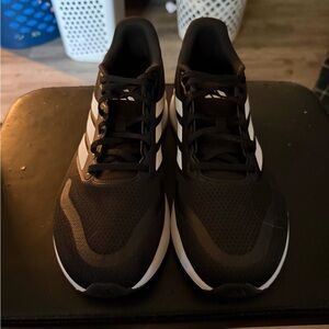 New men’s black Adidas sneakers